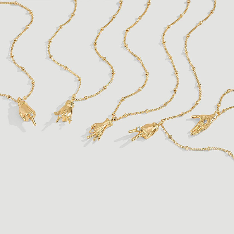 Gold-plated gesture pendant necklace